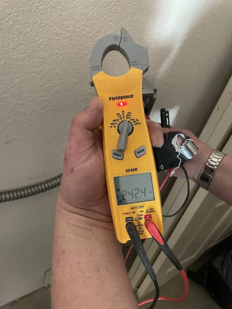 Voltage testing with clamp meter during Ceiling Fan Installation in Prescott